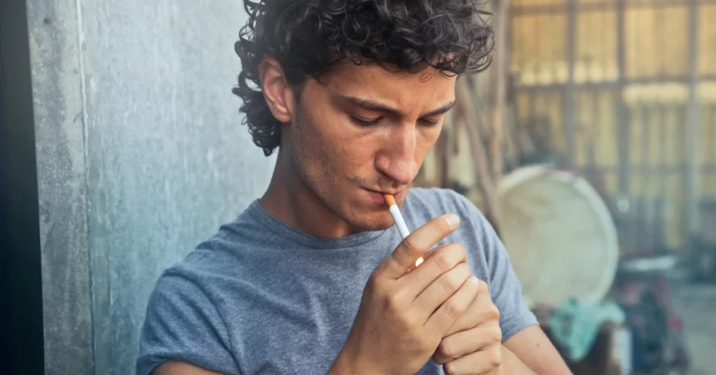 Image of a person who is smoking a cigarette