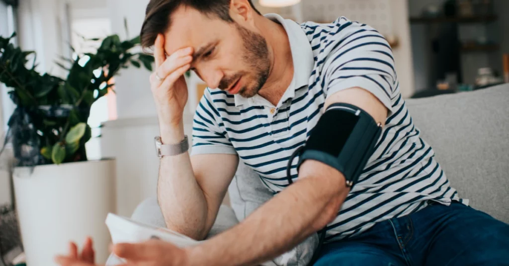 Hypertensive patient performing an automatic blood pressure test 
